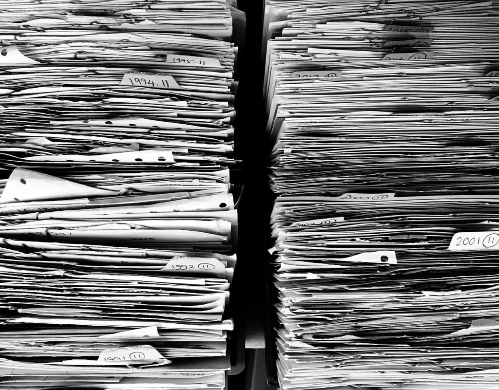 Huge piles of papers in black and white