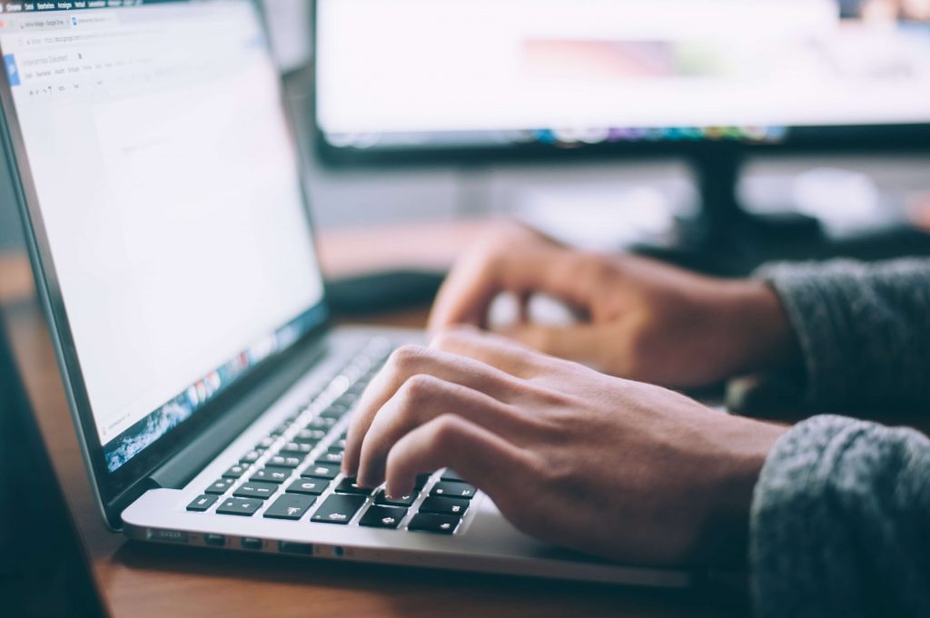 Hands-typing-on-laptop