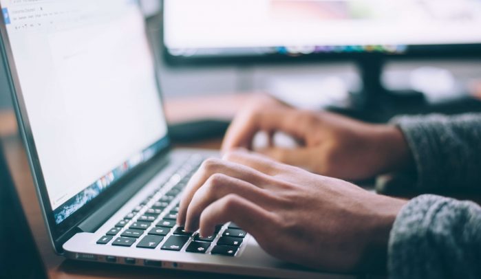 Hands-typing-on-laptop