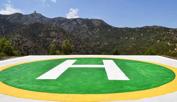 Green-helipad-in-front-of-mountains