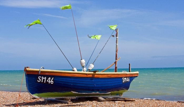 Small-blue-fishing-boat-on-the-beach