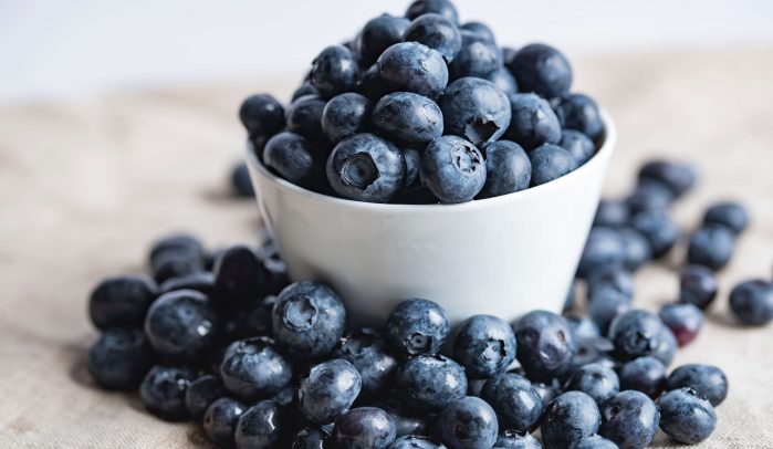 White-bowl-overflowing-with-blueberries