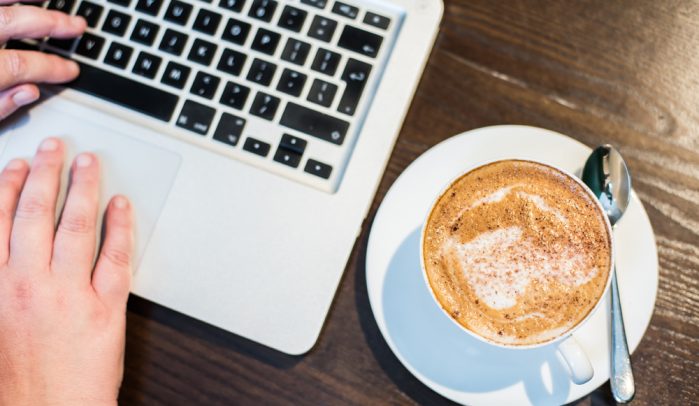 Laptop-keyboard-and-cappuccino-from-above