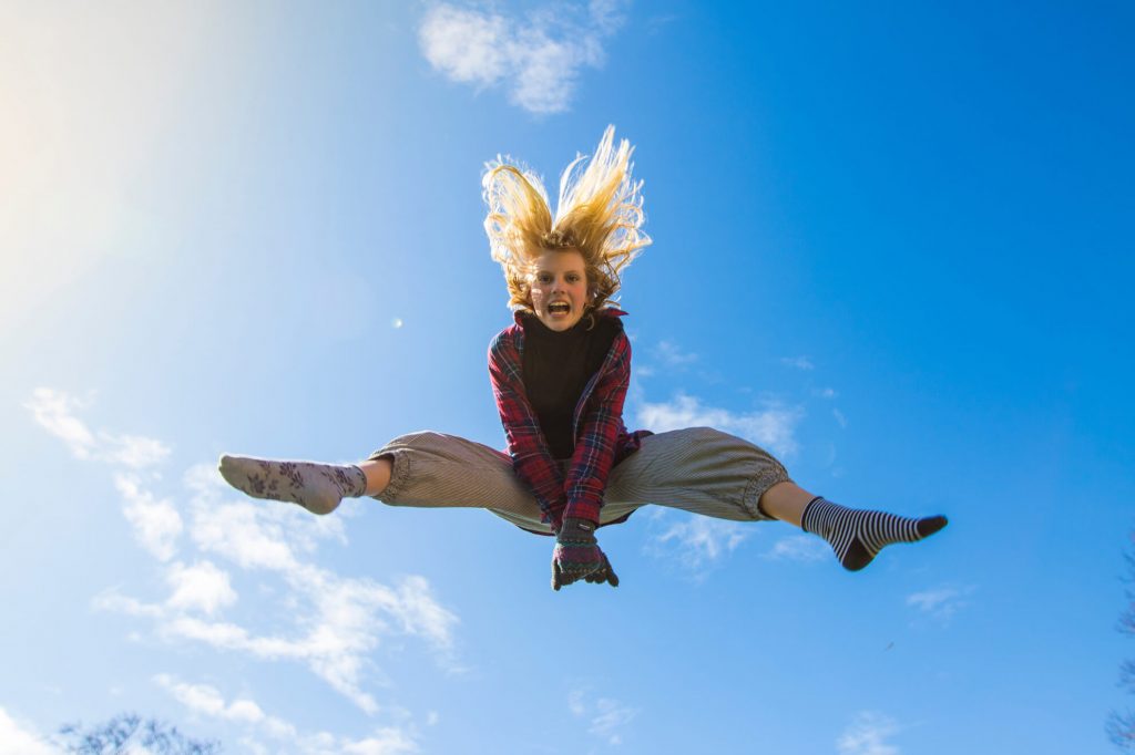 Girl-jumping-high-in-the-sky