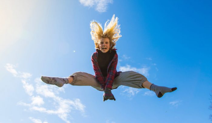 Girl-jumping-high-in-the-sky
