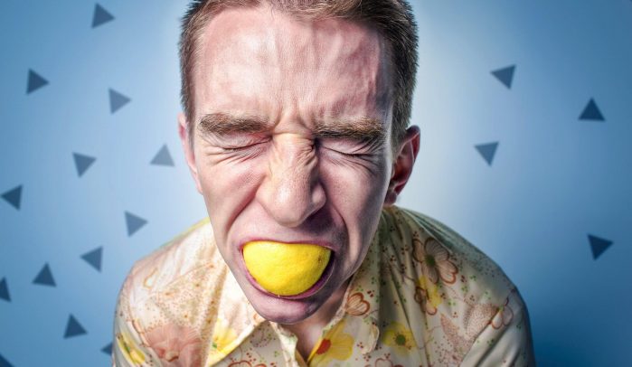 Pained-man-sucking-on-lemon