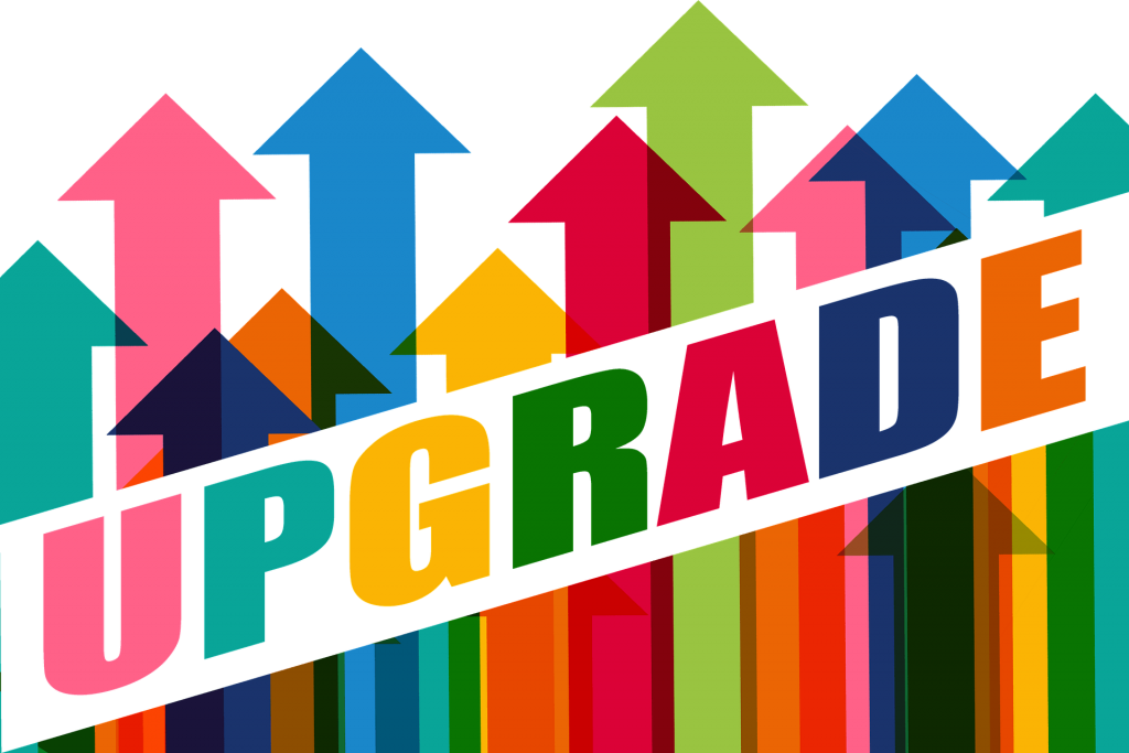 The-word-upgrade-against-backdrop-of-colourful-upward-arrows