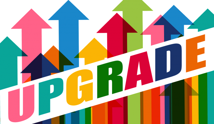 The-word-upgrade-against-backdrop-of-colourful-upward-arrows
