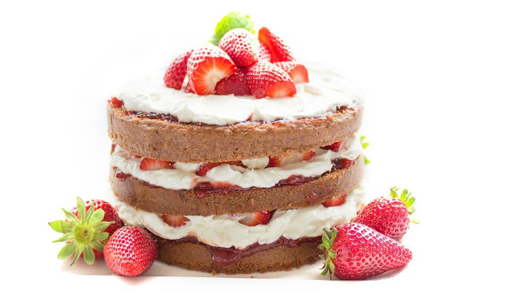 3-tier-chocolate-cake-filled-and-decorated-with-fresh-cream-and-strawberries