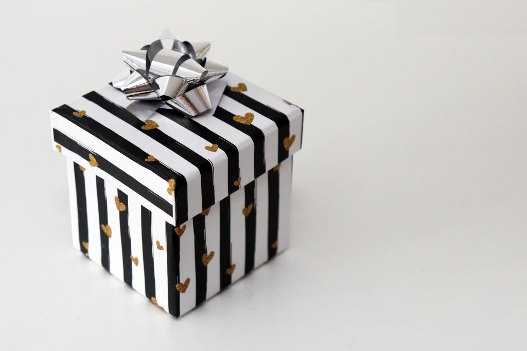 Black and white striped gift box with silver bow