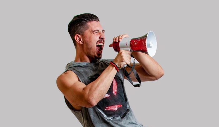 Man-shouting-through-a-megaphone