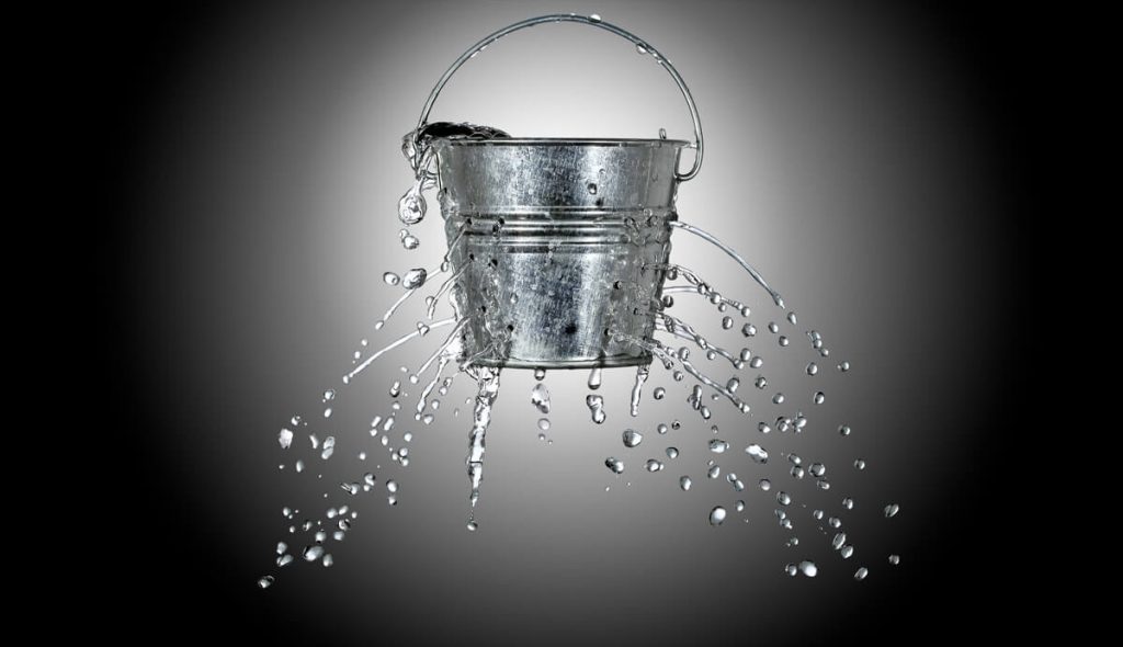 Metal-bucket-leaking-water