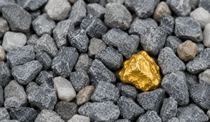 Single-gold-nugget-in-a-pile-of-grey-gravel